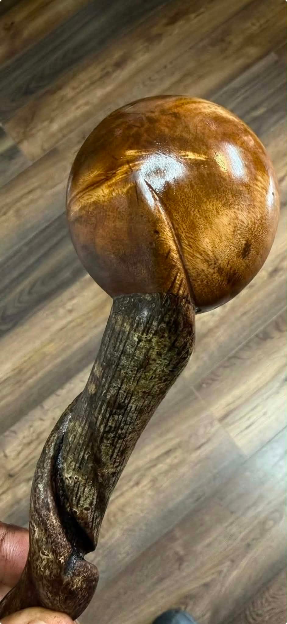A handmade Sherred & Sons shillelagh with a polished knob and a twisted shaft